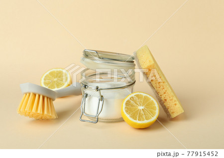 Cleaning concept with eco friendly cleaning tools on beige background Cleaning concept with eco friendly cleaning tools on beige background 77915452