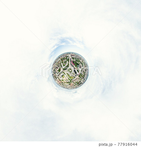 Aerial city view with crossroads and roads, houses, buildings, parks and parking lots. Sunny summer panoramic image 77916044