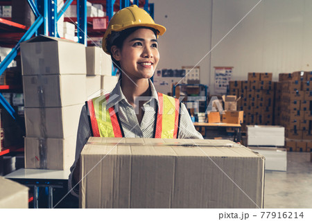 Female warehouse worker working at the storehouse 77916214