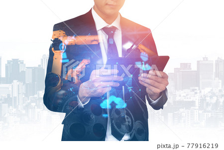 Mechanized industry robot arm and factory worker double exposure Mechanized industry robot arm and factory worker double exposure 77916219