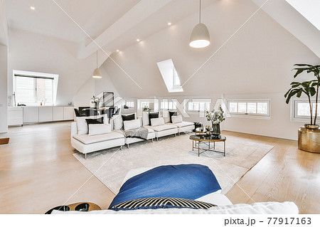 Spacious living room in attic apartment 77917163