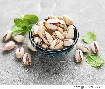 Bowl with pistachios 77917277