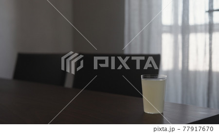 ginger beer in tumbler glass on walnut table indoor ginger beer in tumbler glass on walnut table indoor 77917670