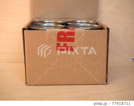 Fragile cardboard box with tin cans Fragile cardboard box with tin cans 77918711