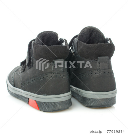 Rear view of men's black autumn boots on a white background. 77919854
