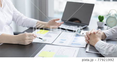 Brainstorm team, Marketers and financial accountants are discussing and analyzing charts to plan strategies to meet customer needs, Using graphs and laptops to analyze business data, Meeting concept. Brainstorm team, Marketers and financial accountants are discussing and analyzing charts to plan strategies to meet customer needs, Using graphs and laptops to analyze business data, Meeting concept. 77921992