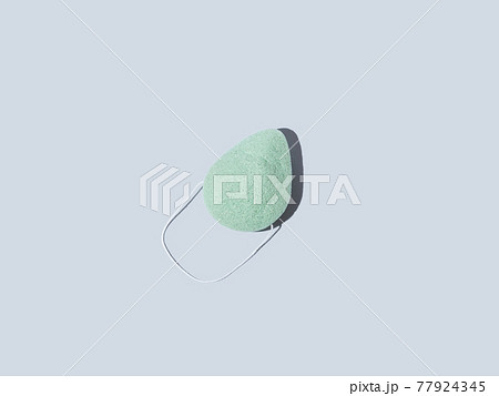 Green natural konjac sponge for face and body washing, zero waste sustainable product on blue Green natural konjac sponge for face and body washing, zero waste sustainable product on blue 77924345