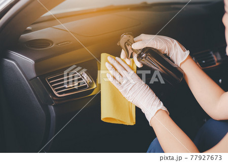 Woman hands using cloth cleaning inside a car,Safety and protect infection during covid-19 virus pandemic situation Woman hands using cloth cleaning inside a car,Safety and protect infection during covid-19 virus pandemic situation 77927673