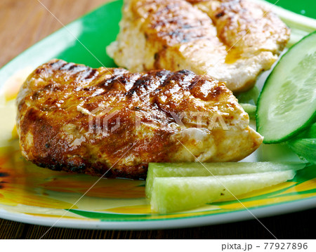 Chicken with sauce piri piri Chicken with sauce piri piri 77927896