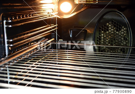 Inside of an empty oven 77930890