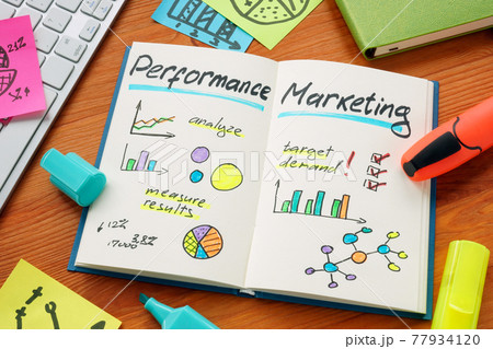 Performance marketing and marks with charts in the notepad. 77934120