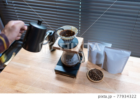 Hand drip coffee, Barista making drip coffee with mockup blank package coffee Alternative ways of brewing Coffee shop concept 77934322
