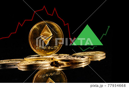 Golden coins with Ether logo rise in bull market. New cryptocurrency Ethereum ETH 2.0 go up in trading. Price of decentralized digital currency is growing up. Electronic money on black background Golden coins with Ether logo rise in bull market. New cryptocurrency Ethereum ETH 2.0 go up in trading. Price of decentralized digital currency is growing up. Electronic money on black background 77934668