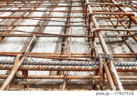 Close up picture of ribbed steel bar reinforcement construction frame ready for concrete casting, selective focus. Close up picture of ribbed steel bar reinforcement construction frame ready for concrete casting, selective focus. 77937528