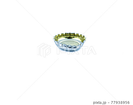 Beer bottle cap on a white background. Beer bottle cap on a white background. 77938956