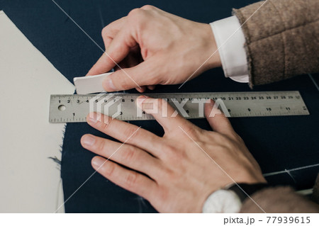 close-up of the tailor's hands close-up of the tailor's hands 77939615