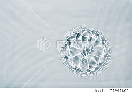 Cosmetic moisturizer micellar water. Abstract flower made from splash of liquid. Soft focus 77947809