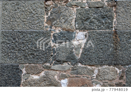 Backgrounds of the old fortress wall. Background of vintage stone wall 77948019