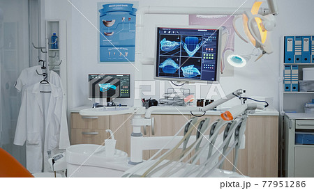 Close up revealing shot medical dentistry display with teeth diagnosis xray Close up revealing shot medical dentistry display with teeth diagnosis xray 77951286