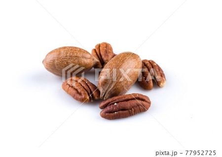 Few pecan nuts isolated on white 77952725