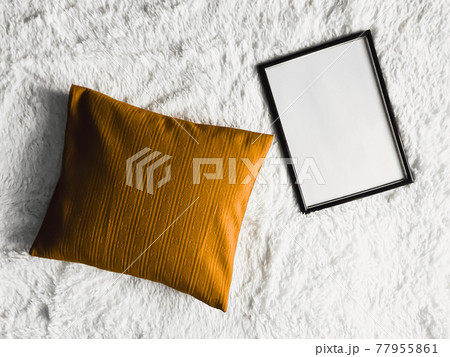 Black thin wooden frame with blank copyspace as poster photo print mockup, golden cushion pillow and fluffy white blanket, flat lay background and art product Black thin wooden frame with blank copyspace as poster photo print mockup, golden cushion pillow and fluffy white blanket, flat lay background and art product 77955861