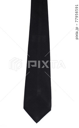 Black necktie isolated on white background. Black necktie isolated on white background. 77956591