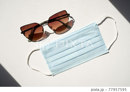 Dark Sunglasses and a blue face mask 77957595