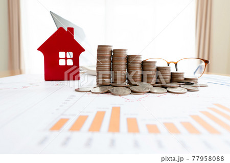 investment concept, Stacked of Coins and house model , graph ,glasses and laptop, investment concept, Stacked of Coins and house model , graph ,glasses and laptop, 77958088