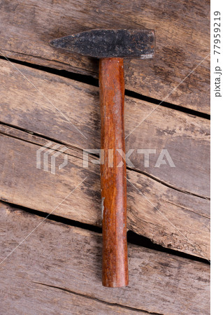 Top view of hammer with wooden handle. Top view of hammer with wooden handle. 77959219