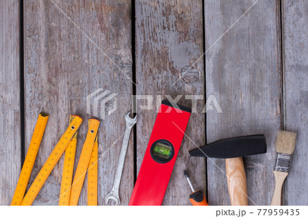 Repairing tool kit on grey wooden background. Repairing tool kit on grey wooden background. 77959435