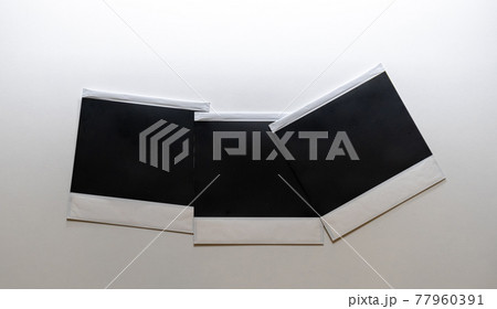 Three blank retro photo frames on white background. 77960391