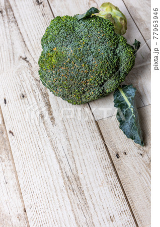 Broccoli Big Fruit on a Light Brown Wood Floor, Healthy Food Broccoli Big Fruit on a Light Brown Wood Floor, Healthy Food 77963946