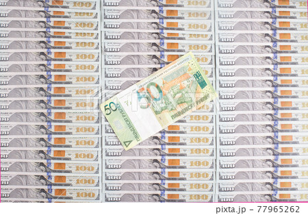 Banknote of 50 Belarusian rubles on the background of dollars. Concept of the ratio of the Belarusian ruble to the dollar currency, financial Banknote of 50 Belarusian rubles on the background of dollars. Concept of the ratio of the Belarusian ruble to the dollar currency, financial 77965262