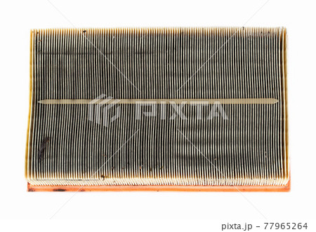 Dirty car air filter texture and background. Air filter element in a car engine, macro, damaged 77965264