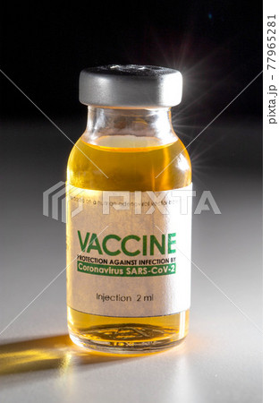 Vial with coronavirus vaccine on a black background, close-up. Vaccine development and research concept SARS-Cov-2 and covid-19 77965281