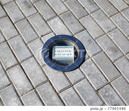 outdoor diode floodlight built into the tile, close-up. Illumination outdoor diode floodlight built into the tile, close-up. Illumination 77965486