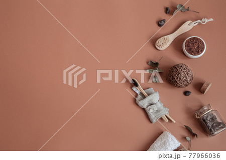 Spa composition with bamboo toothbrushes and body care products copy space. Spa composition with bamboo toothbrushes and body care products copy space. 77966036