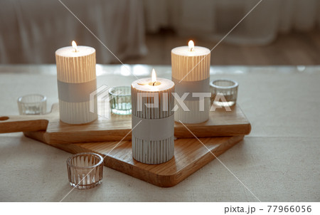 Home still life with burning candles as home decor details. 77966056