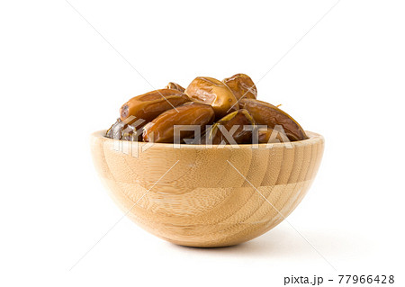 Dates isolated on white background Dates isolated on white background 77966428