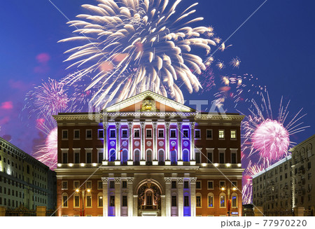 The building of the residence of the Mayor of Moscow with illumination at night, against the background of fireworks. Moscow, Russia 77970220