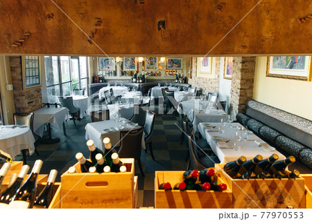 USA - october, 2019 wine restaurant interior with white tablecloths 77970553