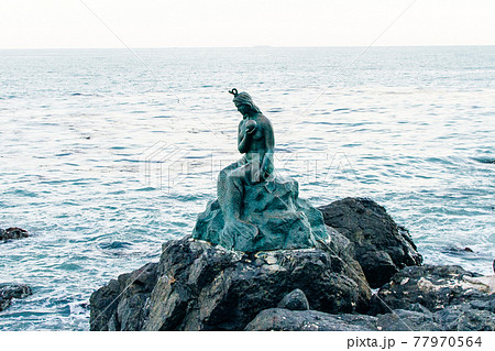 Dongbaekseom, Busan, South Korea - December 2019. Legendary Hwang Ok Princess mermaid statue Dongbaekseom, Busan, South Korea - December 2019. Legendary Hwang Ok Princess mermaid statue 77970564