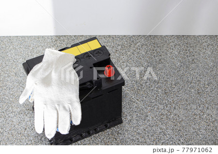 the car battery is in the store, ready to be replaced with a new one 77971062