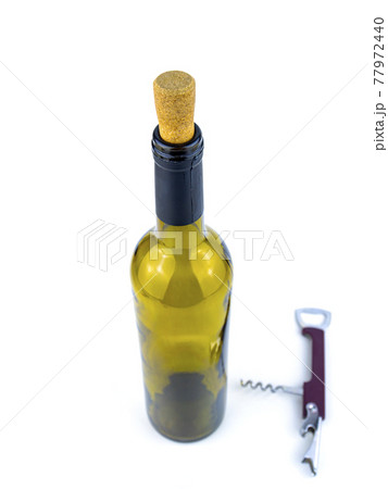 Cork from a wine bottle and a corkscrew on a white background. Cork from a wine bottle and a corkscrew on a white background. 77972440