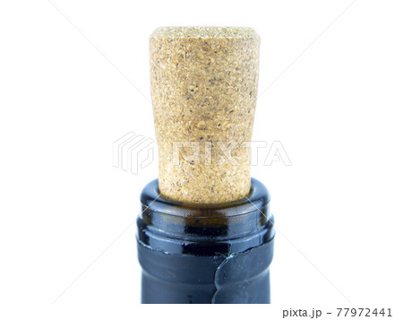 Cork from a wine bottle on a white background. 77972441