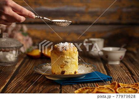 Small cake in a plate Small cake in a plate 77973628