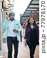 Young couple walking together on urban street. Couple in love concept. 77978170