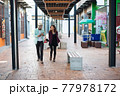Young couple walking together on urban street. Couple in love concept. 77978172