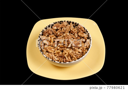 Closeup view of walnut purified on a black background Closeup view of walnut purified on a black background 77980621