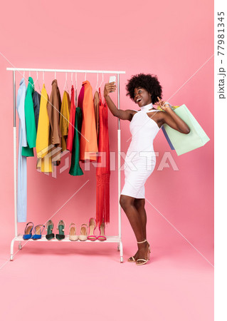 Black Woman Shopping Making Selfie With Shopper Bags, Pink Background Black Woman Shopping Making Selfie With Shopper Bags, Pink Background 77981345